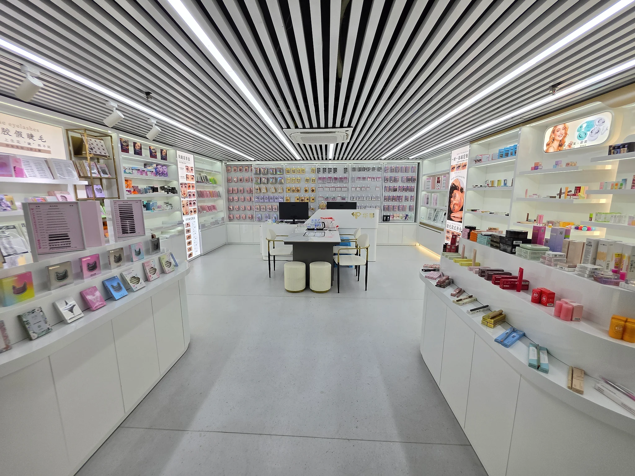 Vespera Beauty showroom with product displays and a buyer review table